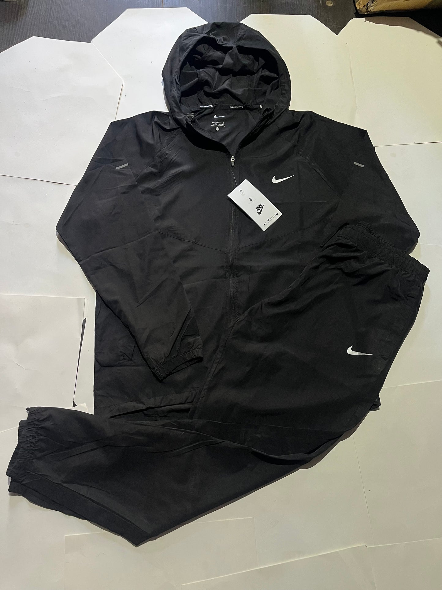 Black Swoosh miller